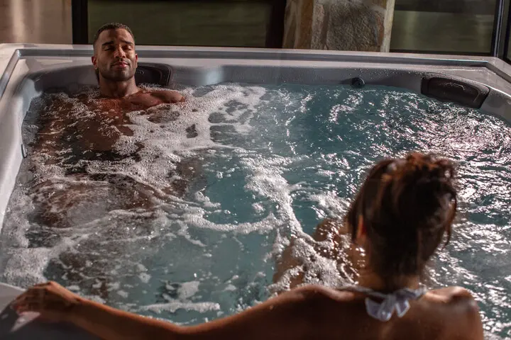couple enjoying hot tub after workouts - jacuzzi hot tub installation